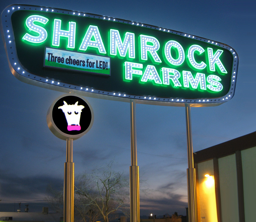 Shamrock Farms sign lights after Three cheers for LED! with cow logomark